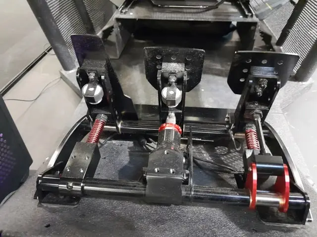 The back of a set of Fanatec ClubSport V3 sim racing pedals showing the different mechanisms on each pedal.