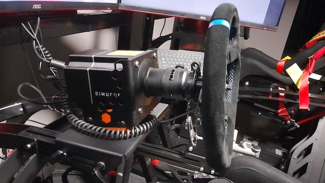 Simucube 2 Sport sim racing wheel base with Cube Controls GT Sport wheel rim connected, using the Simucube mount.