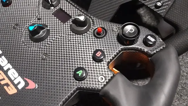 Close up of the Fanatec McLaren GT3 V2 sim racing wheel showing the buttons and rotary encoders.