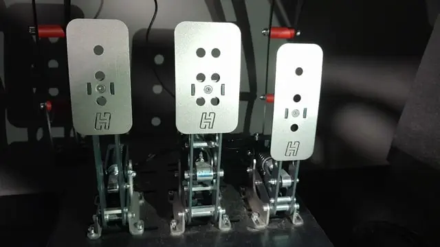 Close up of the Heusinkveld Sprint sim racing pedal faces mounted to a cockpit. 